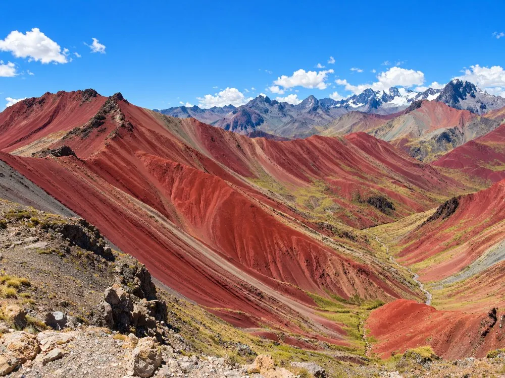 The folded rust-red slopes of the Red Valley seen from a high ridge
